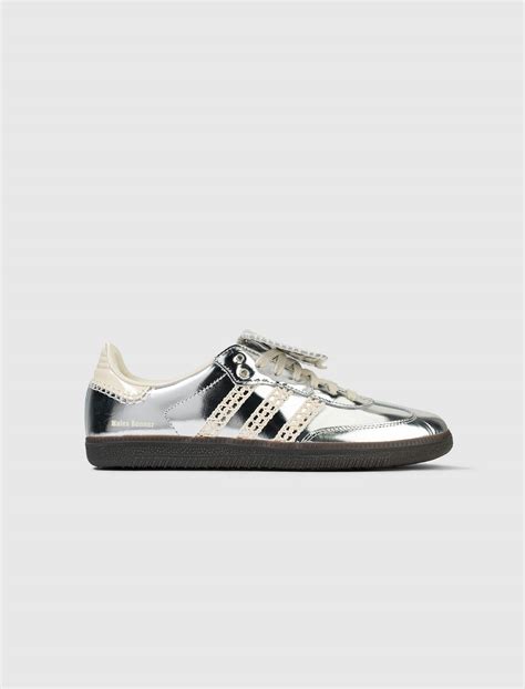 silver adidas with flap tongue